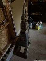 Full view of the Hoover upright steam vacuum showing the entire unit including handle, body, and power cord.