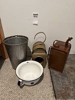Vintage Kenlite lantern, Valor oil can, galvanized metal bucket, and white enamel pot on carpet and tile floor