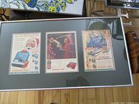 Framed set of four Canada Dry vintage advertising prints in a silver frame with black mat.