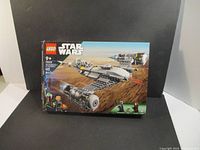 Full box front showing LEGO Star Wars branding, age 9+, set number 75325 and image of The Mandalorian's N-1 Starfighter.