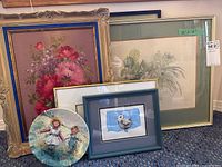 Lot containing four framed art pieces and one decorative plate