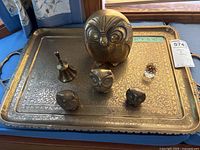 All items arranged on ornate brass tray