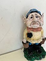 Front view showing the sad facial expression, front clothing details, and buckets held by the gnome figurine.