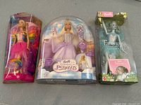 Front packaging view of all three dolls: Fairytopia Sparkle Fairy, Magic of Pegasus, and Magic of the Rainbow Elina