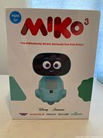 Front of sealed box showing Miko 3 robot with age recommendation 5+ and brand logos.