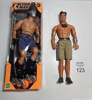 Photo of two 12-inch action figures: Action Man in box and Max Steel loose figure.