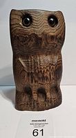 Front view of the vintage wood carved owl showing textured wood grain and dark eyes