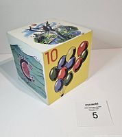 Single large block featuring balloon illustration with number 10, side showing underwater scene with fish and octopus.