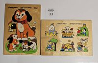 Two vintage Fisher Price wooden tray puzzles in natural wood trays with colorful cartoon illustrations, placed side by side on a white surface.