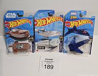 Front view photo of three sealed Hot Wheels cars from Star Wars, Star Trek, Marvel X-Men franchises.