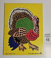 Photo of the assembled Thanksgiving turkey tray puzzle on a yellow tray base.