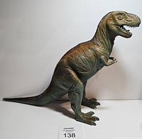 Full side view of the large Tyrannosaurus Rex toy showing body proportions and texture.