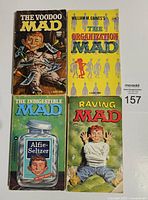 Four Mad Magazine novels with covers visible: The Voodoo Mad, The Organization Mad, The Indigestible Mad, Raving Mad.