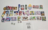 Full lot of assorted Mini Brands collectibles and tiny branded product miniatures, neatly arranged on flat surface.