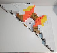 Side view of the Nerf Minecraft Bow showing the pixelated colors and Minecraft logo, with arrow attached.