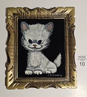 Front view of the vintage velvet painting featuring a white Persian kitten with ornate gold frame and signature J.R. Browning.