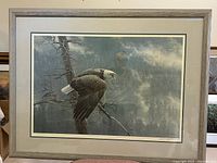 Full view of framed lithograph in grey frame