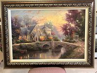 Full view of framed Lamplight Manor giclée canvas