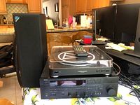 Full view of receiver, turntable, remote and speaker