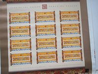 Full view of the uncut sheet with all twelve stamps visible