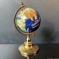 Front view showing Africa, Indian Ocean and brass stand