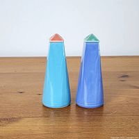 Front view of both conical shakers showing body and contrasting tops