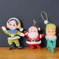 Front view of all three ornaments standing side-by-side