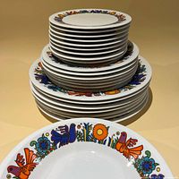 Stacked set of Acapulco pattern plates and bowls