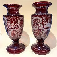 Pair of ruby cut-to-clear vases front view
