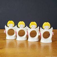 Front view of all four angel napkin rings