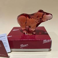 Rose crystal water buffalo figurine atop Moser box, left side view