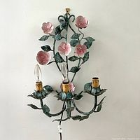 Front view of floral metal sconce showing overall design and dimensions proportion