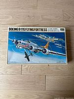 Top view photo of the Boeing B-17G Flying Fortress model kit box showing artwork of the bomber and aircraft in flight.
