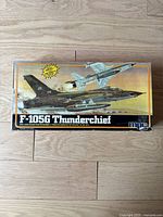 Top of the model kit box showing artwork of the F-105G Thunderchief aircraft flying with another jet in the background.
