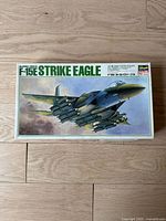 Full front view of the F-15E Strike Eagle model kit box showing the aircraft artwork and labeling.