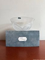 Side view of the J.G. Durand cristal bowl on its original box showing the frosted petal-like design and product label.