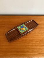Top view of mid-century Japanese wooden cheese board with floral ceramic tile and cheese knife