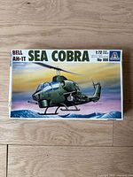Top view of the Italeri Bell AH-1T Sea Cobra model kit box, showing box art with helicopter over water.