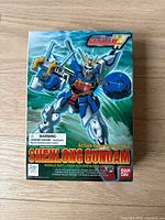 Box front showing colorful Shenlong Gundam artwork and product details such as warnings and Bandai logo
