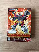 Boxed packaging showing vintage Bandai Gundam Heavyarms model kit with artwork and branding.
