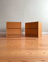 Front view of two nightstands side by side on hardwood floor
