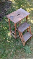 Overall view showing oak folding step stool with two steps extended