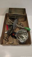 Tray showing all items including loaf pans, beaters, cutters and flour sifter