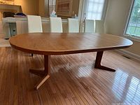Front angle view of round table in closed position