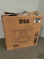 Front of original cardboard box labeled “DS6 Dipole Surround Loudspeaker” with B&W logo and speaker illustration