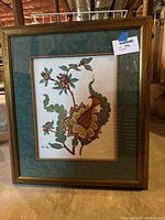 First framed botanical art print with wooden brown frame, floral botanical illustration with teal matting.