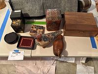 Overview photo showing all items included in the lot arranged on a table.