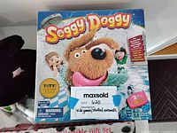 Soggy Doggy board game box showing dog in bath on front