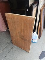 Top-down view of the plywood dolly showing wood grain and surface wear.