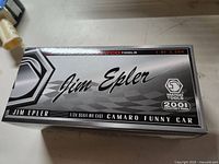 Box top showing Matco Tools Jim Epler 1/24 scale die cast Camaro Funny Car branding and edition info.